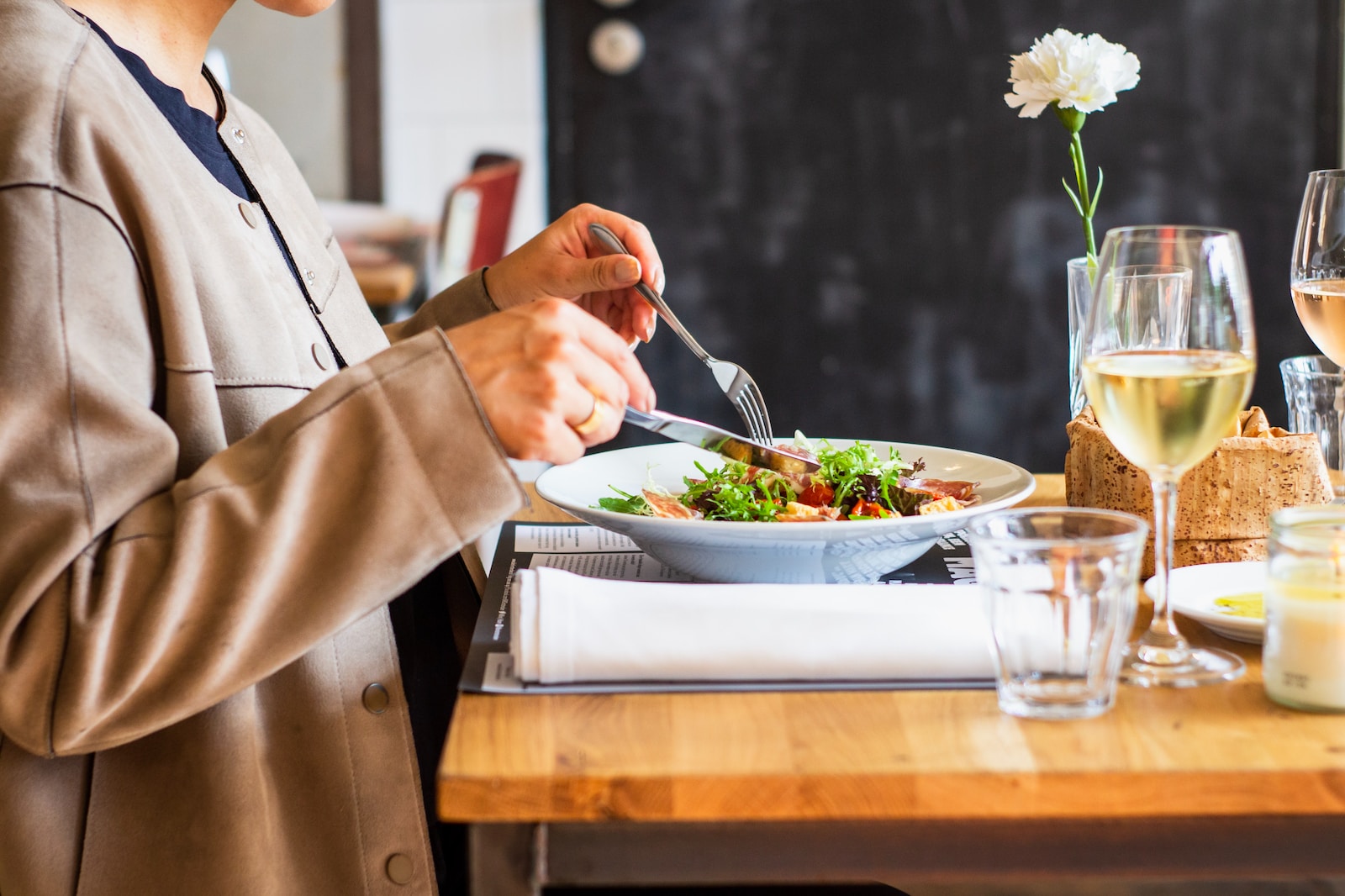 person eating vegetable salad